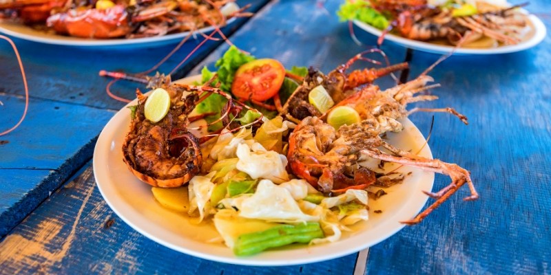 A table filled with various seafood dishes, showcasing the culinary offerings of Jersey Shore seafood shacks.