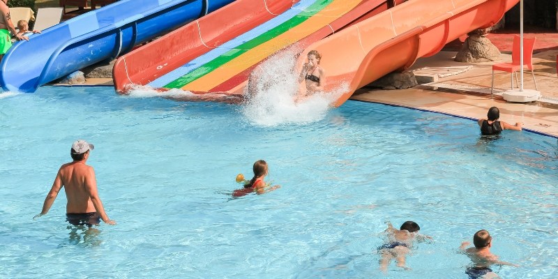 A lively group of people enjoying various attractions at a water park in Wildwood Beach, Jersey Shore.