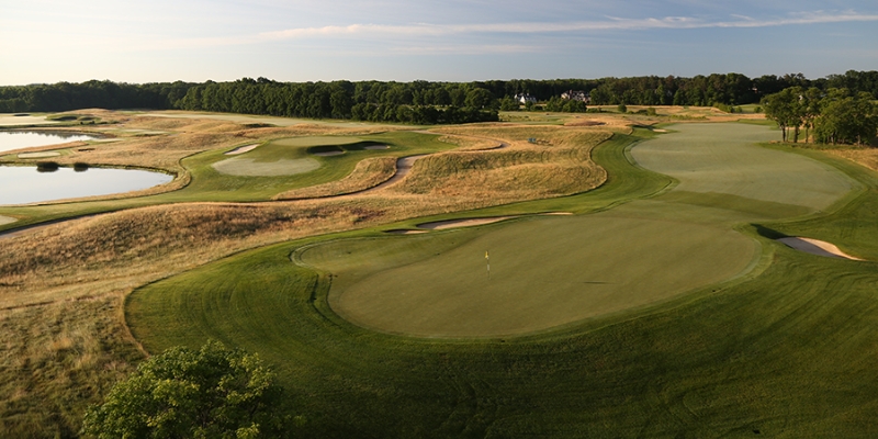 Expansive golf course at Trump National Golf Club, with vibrant greens and a picturesque lake setting at Jersey Shore.
