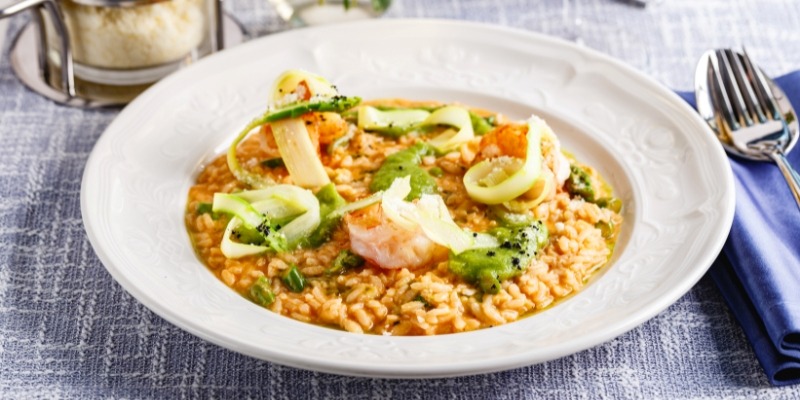 A white plate featuring shrimp and dish, served at JBJ Soul Kitchen near Tinton Falls, NJ.