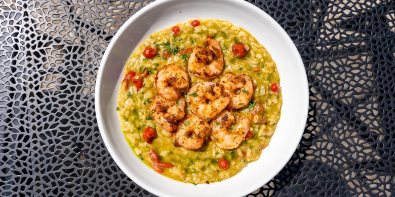 A white plate featuring shrimp and dish, served at JBJ Soul Kitchen near Tinton Falls, NJ.