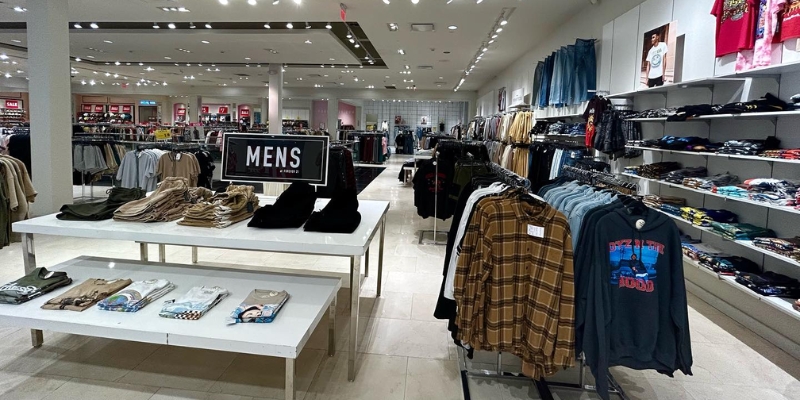 A vibrant clothing store in Monmouth Mall, Tinton Falls, displaying an assortment of fashion items for shoppers.