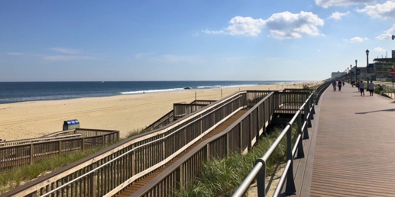 A scenic boardwalk leads from the dunes to the beach and ocean at Long Branch Beach, close to Asbury Park.