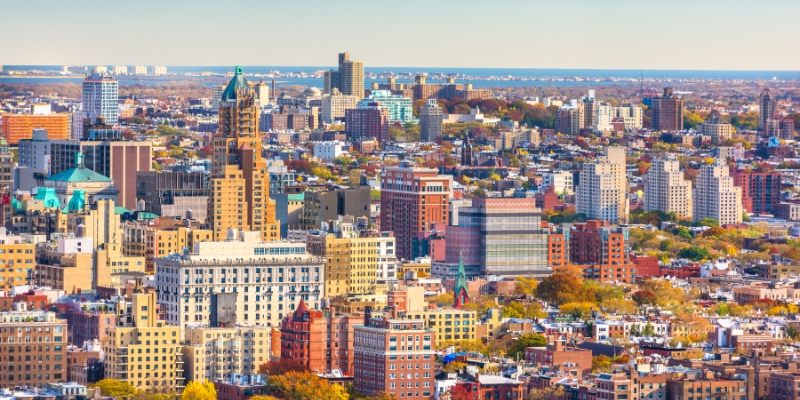 Aerial view of New York City showcasing skyscrapers and urban landscape, with a focus on attractions near Monmouth University.