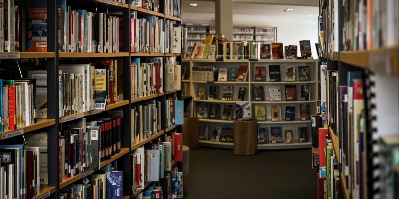Interior view of a book shops with numerous books on shelves, located at the Books & Books bookstore near Monmouth University.