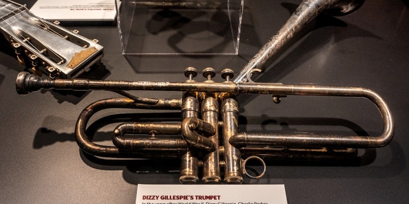 A trumpet and guitar on display, symbolizing the music culture celebrated in the Bruce Springsteen Archives at Monmouth University.