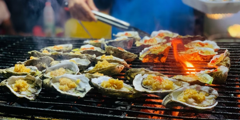 Grilled oysters served at the Red Bank Guinness Oyster Festival, showcasing a popular dish at the Jersey Shore.