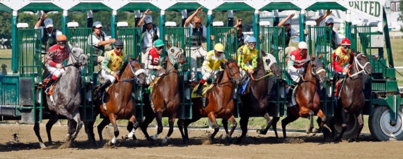Horses sprint down the track at the Monmouth Racetrack, capturing the energy and spirit of this prestigious horse racing event.