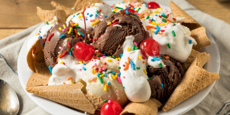 A bowl of chocolate ice cream topped with colorful sprinkles, featured in an article about August activities in New Jersey.