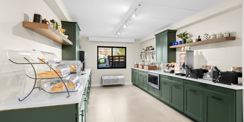 A kitchen featuring green cabinets and a counter, part of the New Jersey Shore itinerary for a morning at Social Centre Bistro.