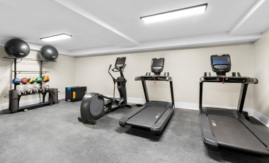 Fitness center featuring treadmills and various exercise equipment at a hotel near Jersey Shore Premium Outlets.