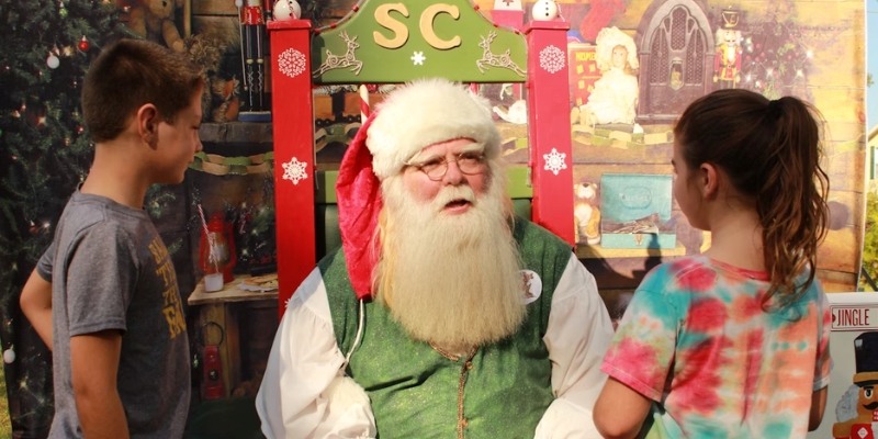 Santa Claus poses at the fairgrounds, part of the festive Christmas activities at the Jersey Shore.