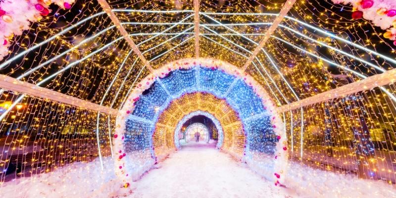A winter tunnel at the Jersey Shore, adorned with lights and flowers, creating a vibrant and inviting atmosphere.