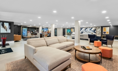 Hotel Near Hackensack University Medical Center NJ - 24-Hour Front Desk Latitude Suites lobby, featuring stylish furniture and decor, near Hackensack University Medical Center.