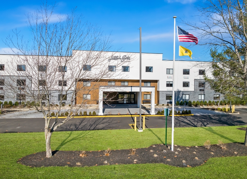 Latitude Suites surrounded by a grassy field, located close to Paramount Theatre in Asbury Park.