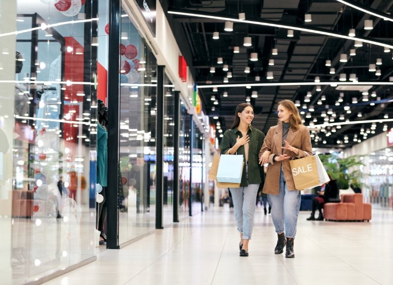 Hotel-Near-Tinton-Falls-Shopping-Center-1 Two women walk through a mall, carrying shopping bags, at the Tinton Falls Shopping Center.