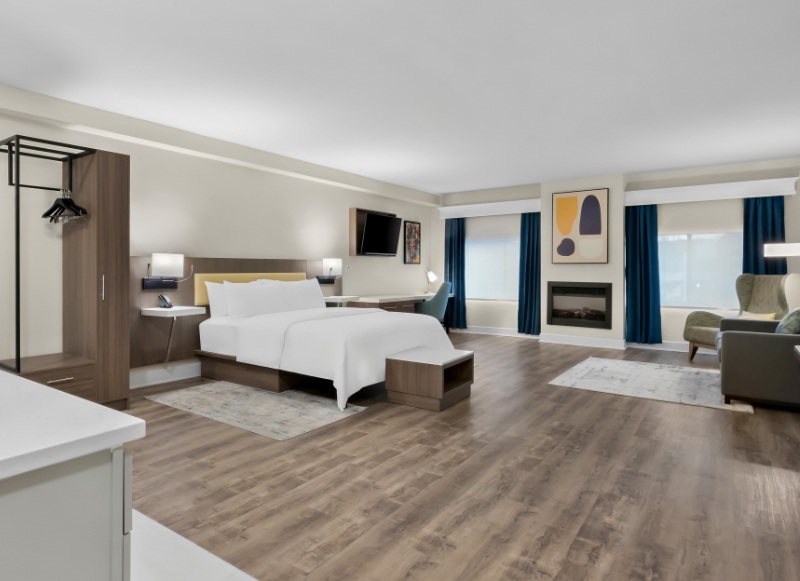 Hotel room featuring a bed, desk, and television, located near MetLife Stadium.