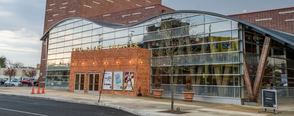 Hotel-Near-Two-River-Theater-Red-Bank-Local-Guide Front view of Two River Theater in Red Bank, featuring a modern curved glass facade.