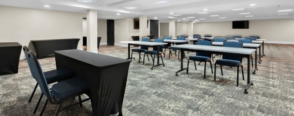Flexible hotel event room with tables and seating for meetings near PNC Bank Arts Center