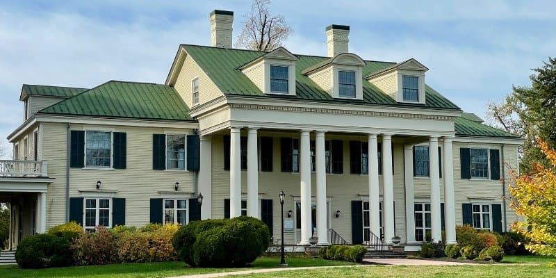 Historic mansion and open grounds at Thompson Park for outdoor activities
