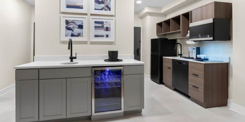 Full kitchen at Latitude Suites for convenient long-term stays in Tinton Falls