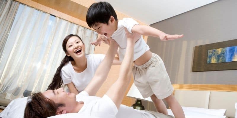 Family enjoying a comfortable long-term hotel stay at Latitude Suites