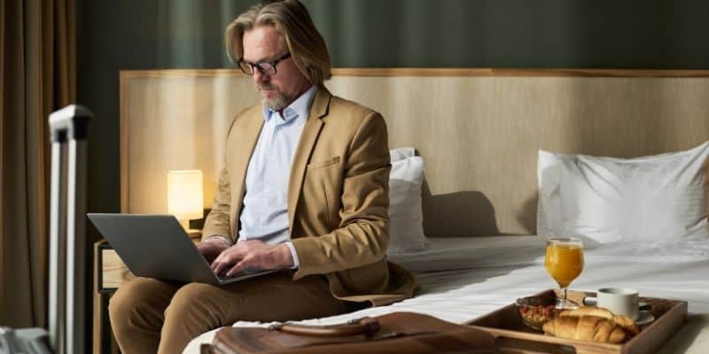 Business traveler working from a hotel room near Tinton Falls
