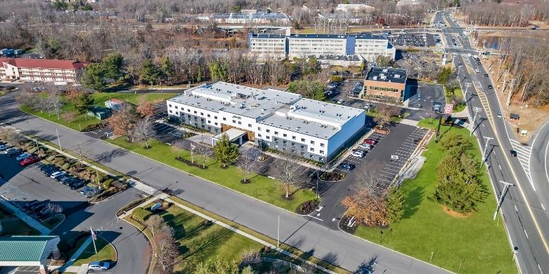 Aerial view of Latitude Suites with convenient access around Tinton Falls