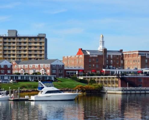 Scenic Red Bank waterfront view with brick buildings and boats.