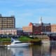 Scenic Red Bank waterfront view with brick buildings and boats.